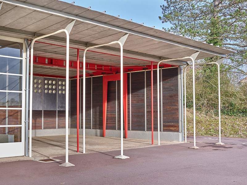 The covered play area from the yard, the roof carried on its splayed struts